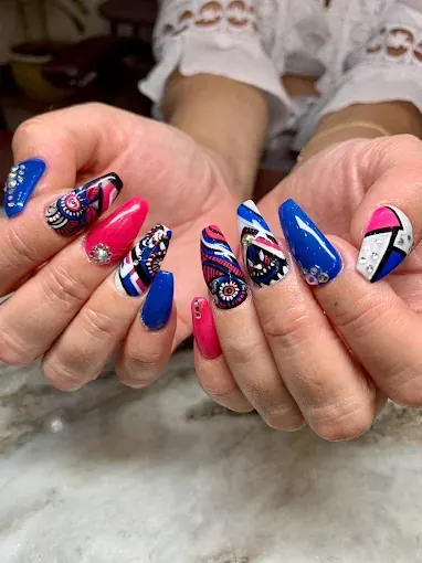 Bold red, navy and white abstract nail art on almond nails