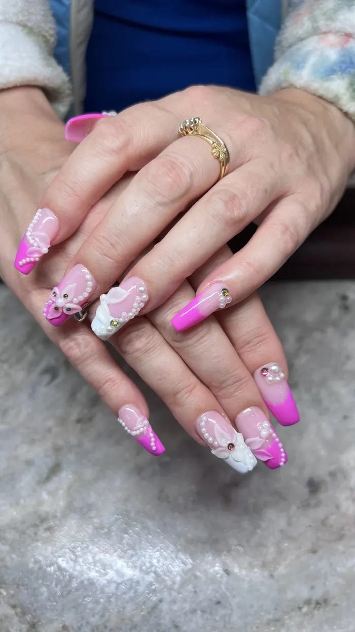 Lilac stiletto nails with three dimensional floral detail